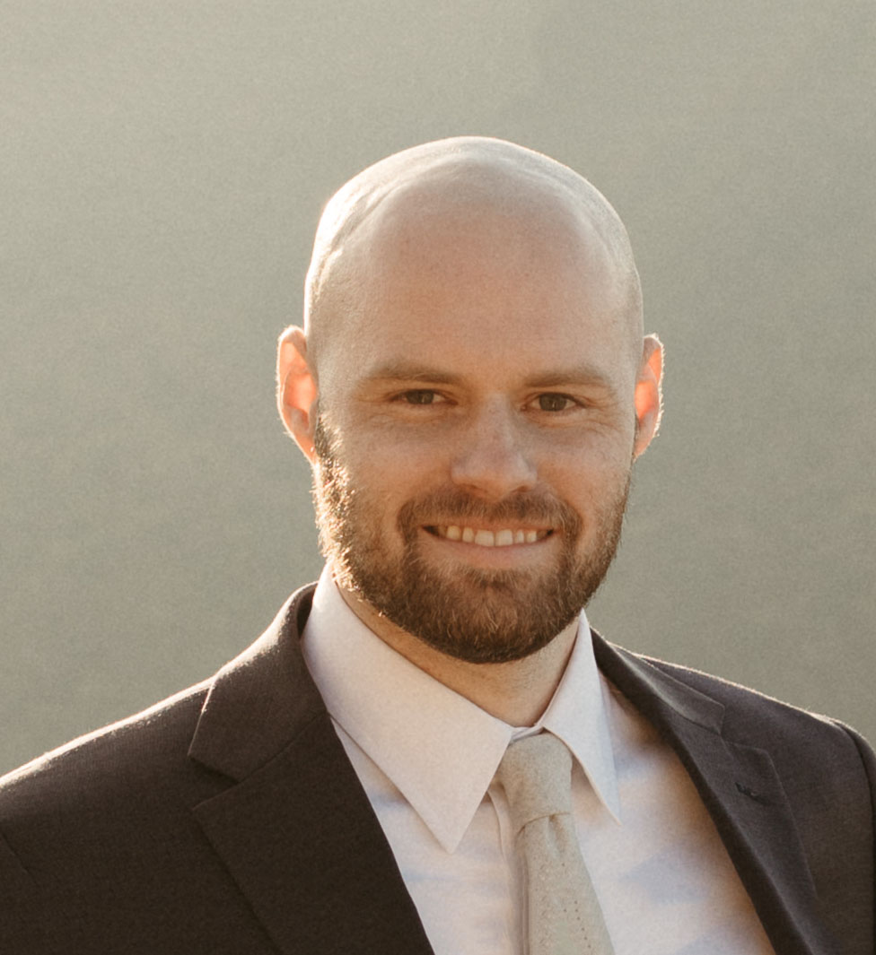 Daniel Welch, a quality assurance engineer at Magnolia Development, smiling in a professional headshot.