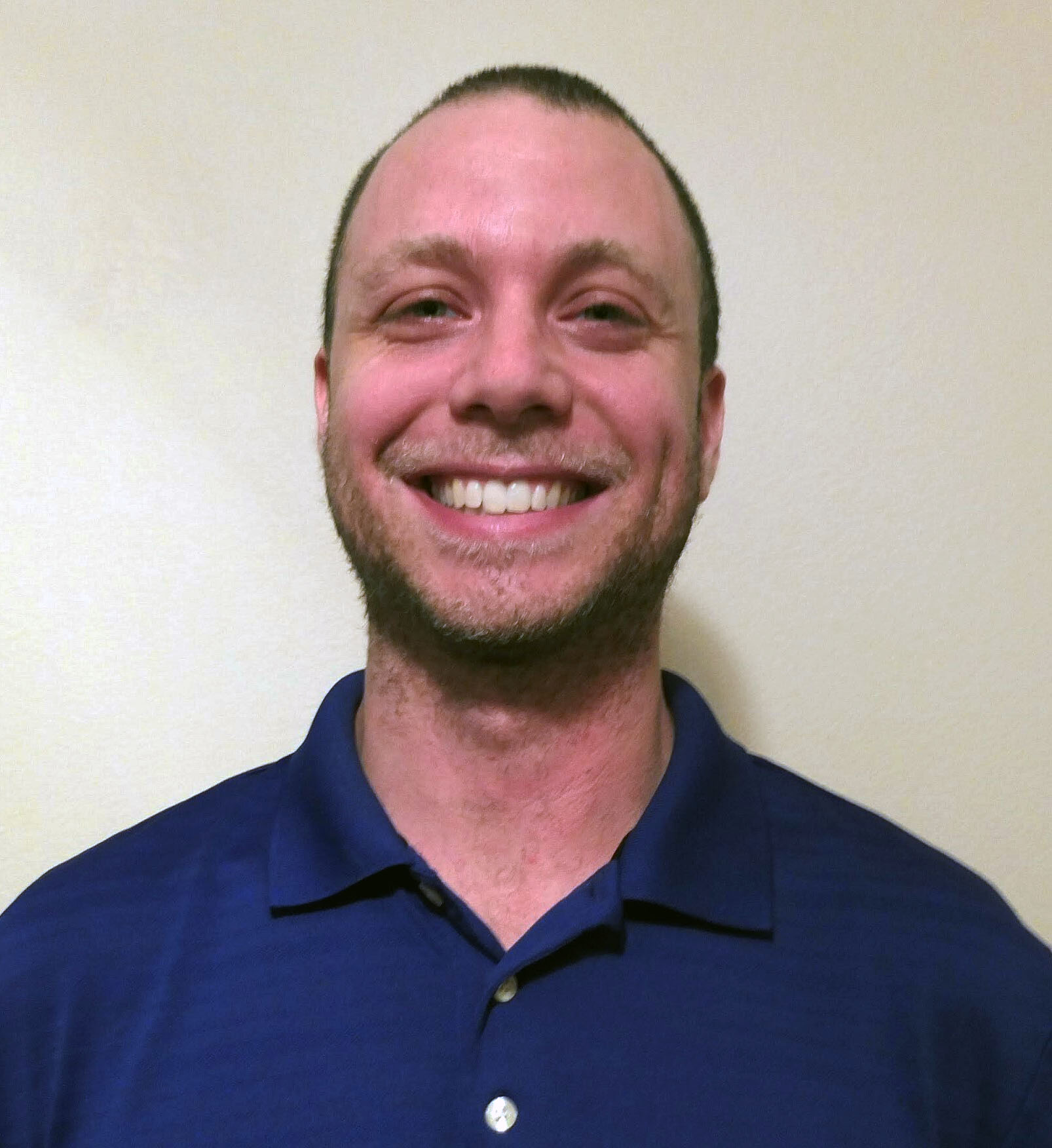 Jason Pennini, a full-stack developer at Magnolia Development, smiling in a professional headshot.